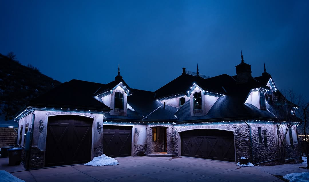 Well-lit Calgary home exterior with permanent security lighting along the roofline